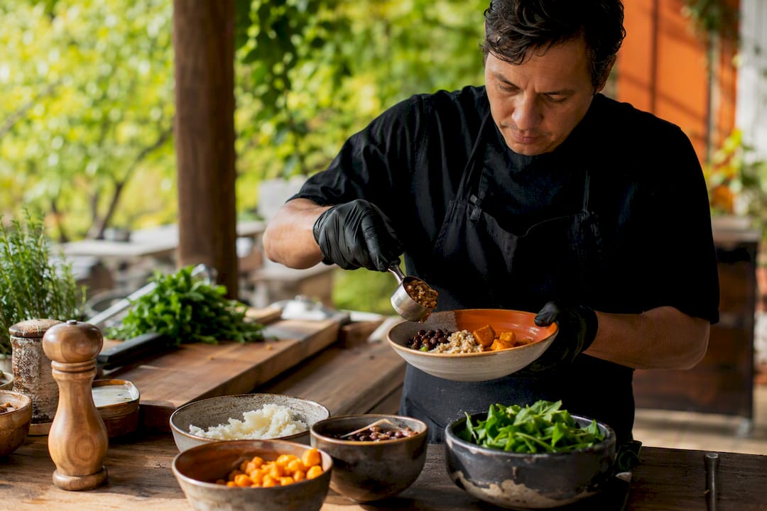 Chef portioning food in kitchen