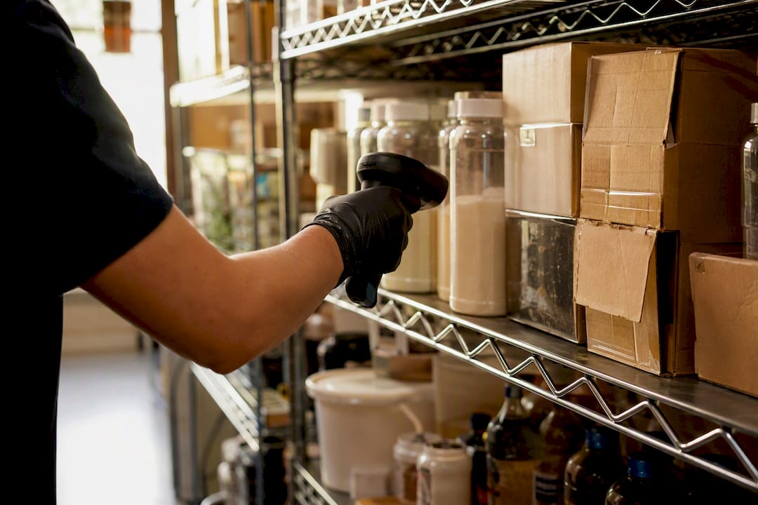 Hand scanning inventory in restaurant storage