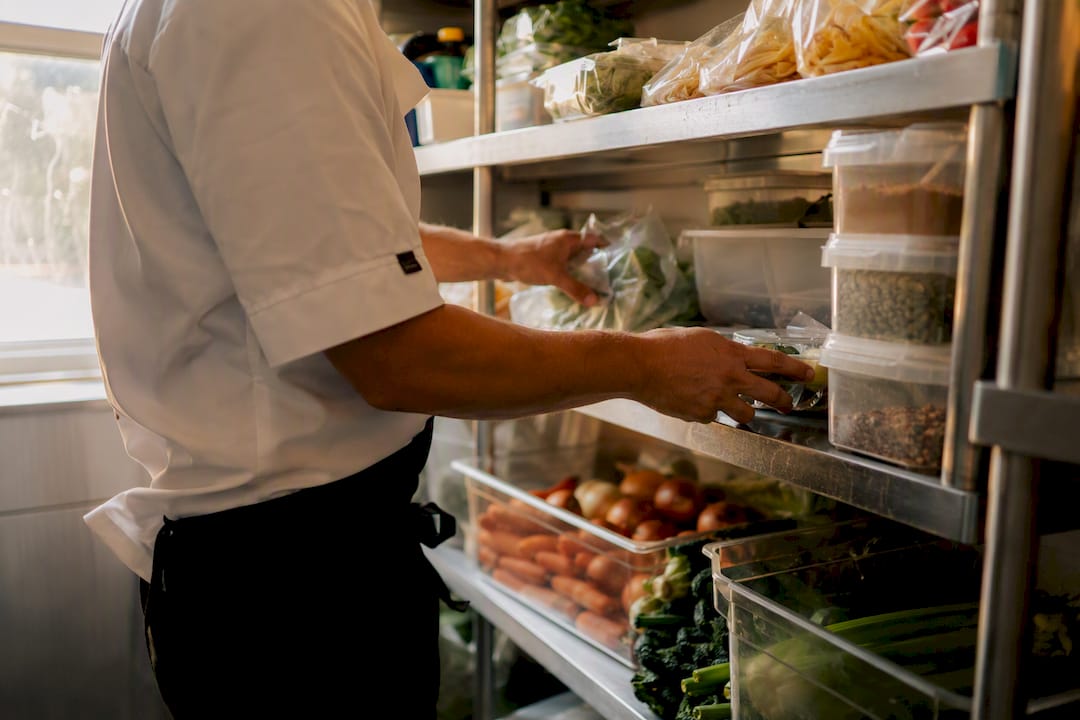 Chef hands organizing food stock