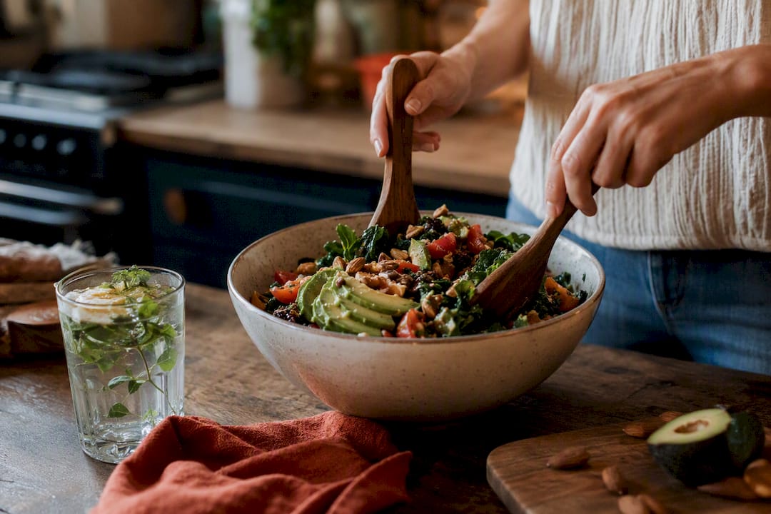 Hands seasoning antioxidant-rich meal plate