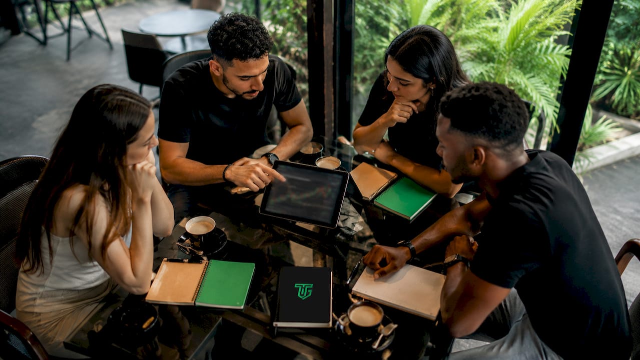 Traders collaborating around table in coworking space