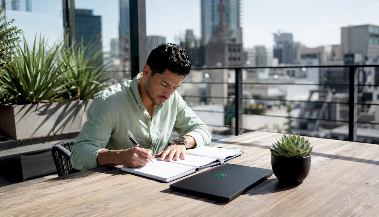 Trader planning schedule on park bench outdoors