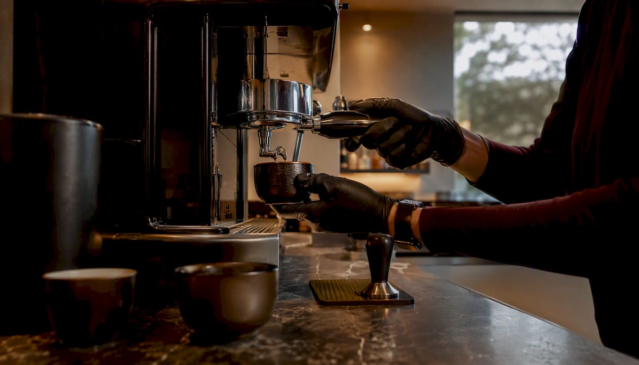 Recessed lighting illuminating coffee bar workspace