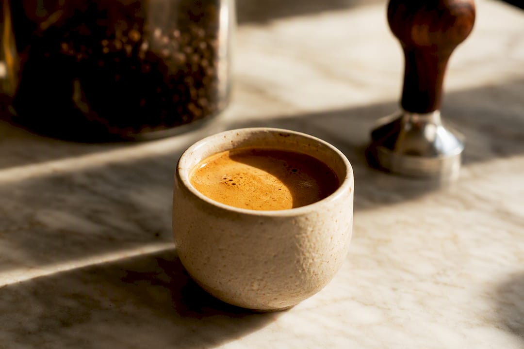Close-up of espresso crema on shot