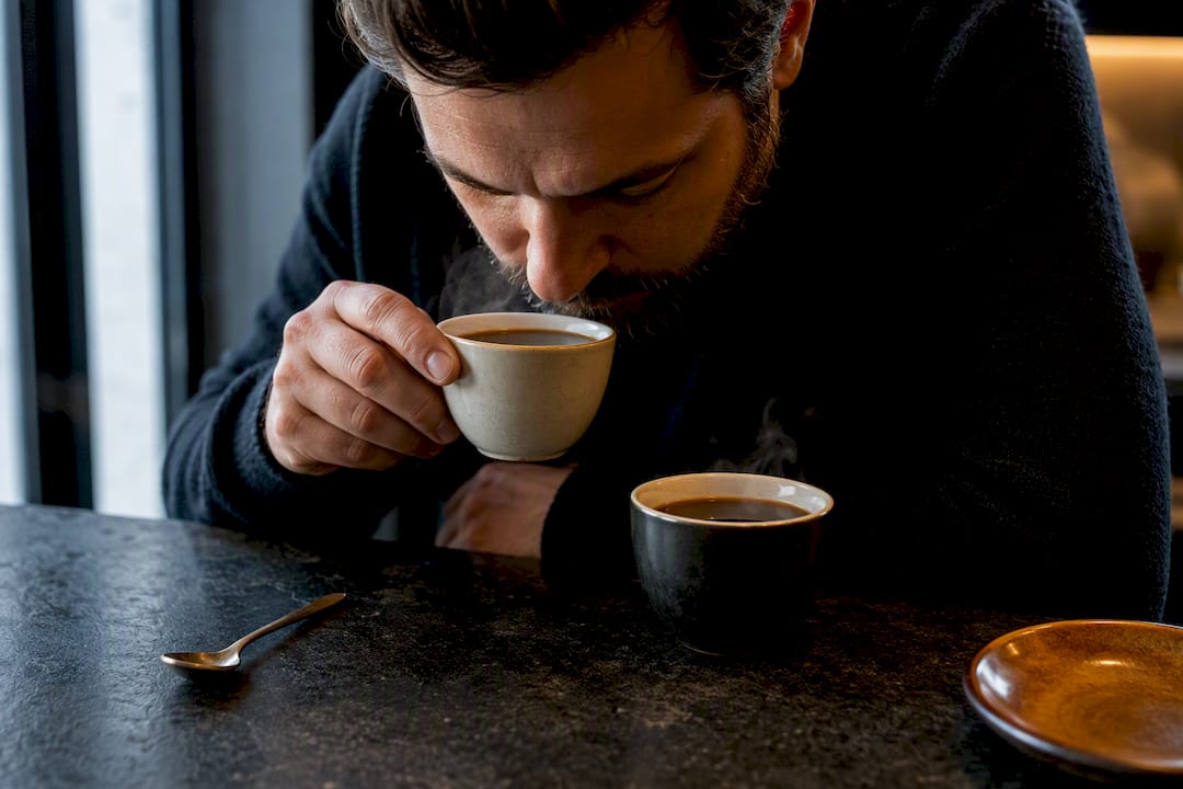 Taster comparing two coffee samples