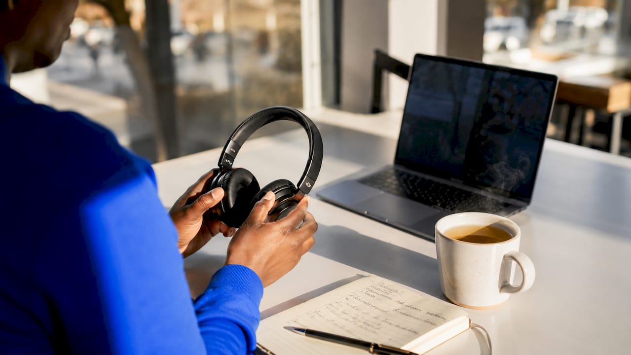 Hands preparing for virtual mental health appointment at desk