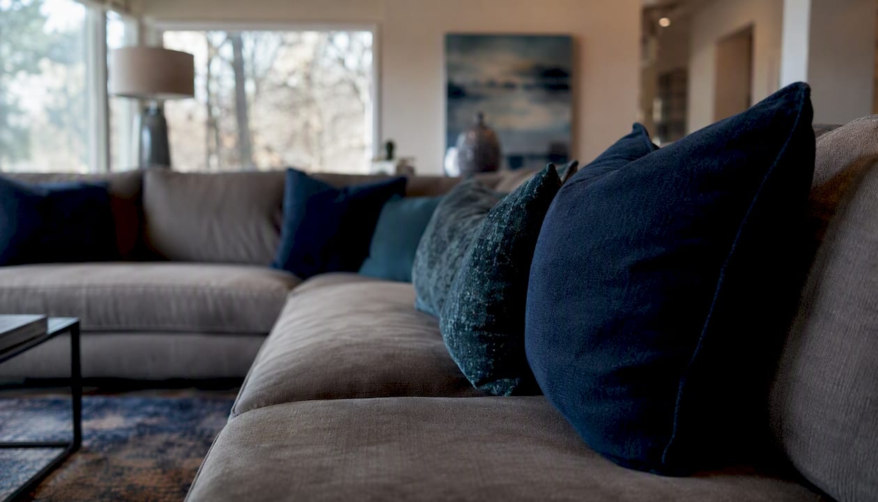Cozy living room corner with custom sofa silhouette
