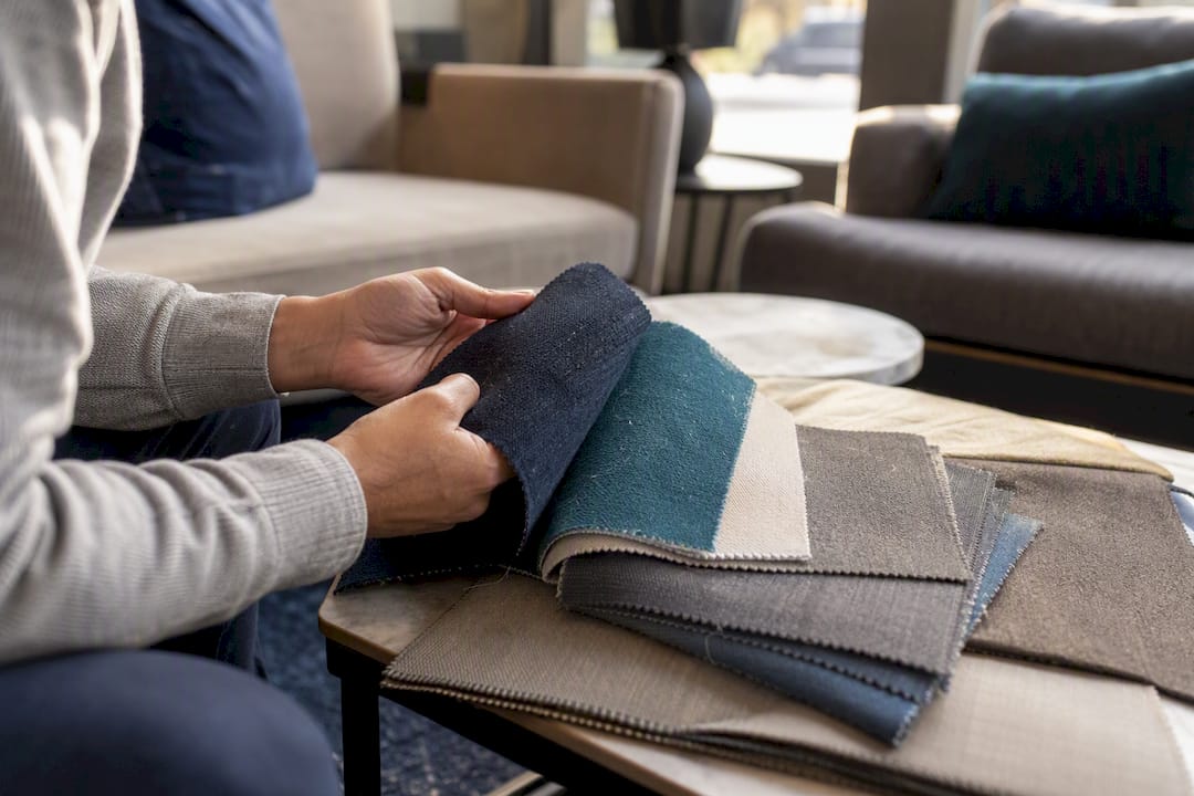 Sofa fabric swatches with pet hair visible