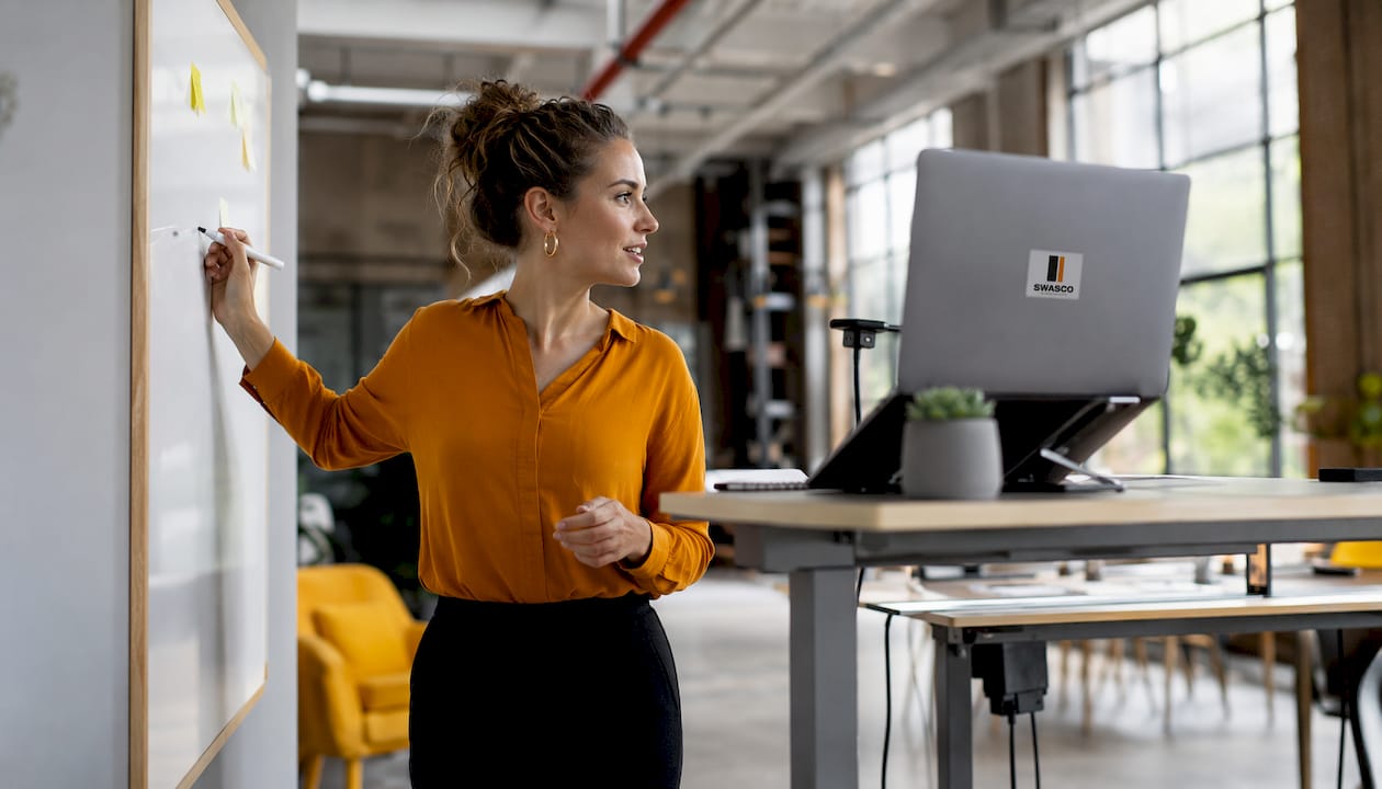 Woman capturing leads in office setting