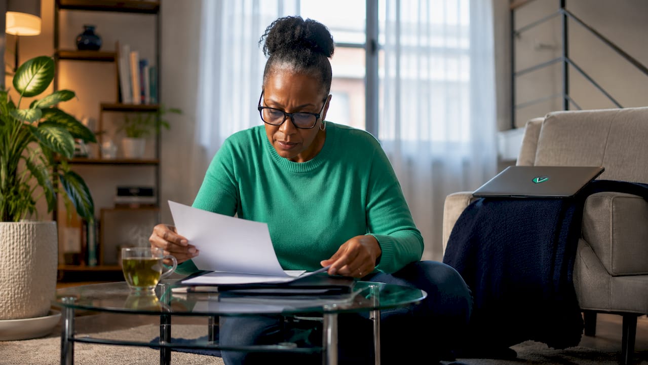 Woman reviewing home business permit documents