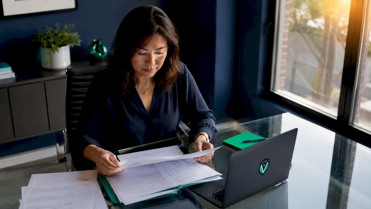 Business owner reviewing permit documents