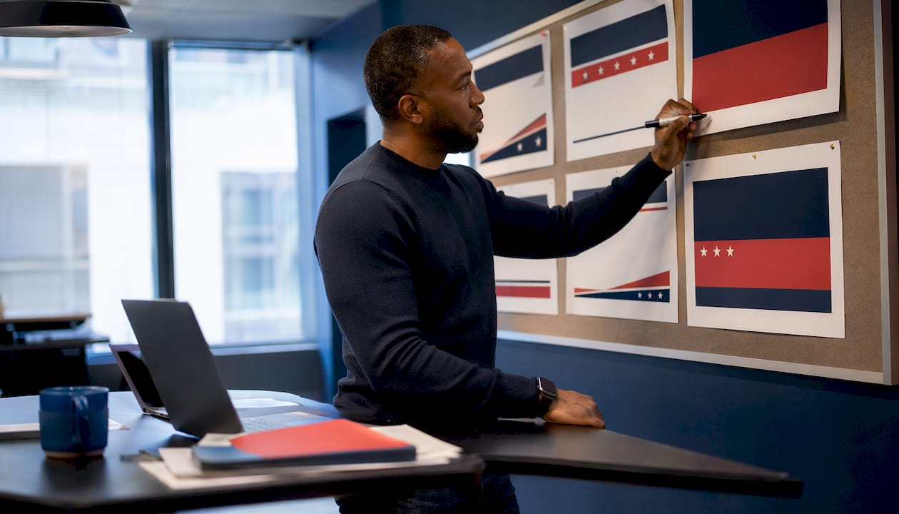 Campaign strategists reviewing yard sign designs