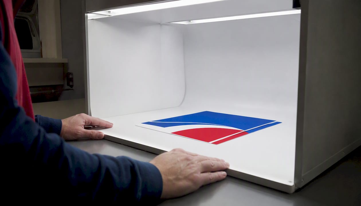 Color proof in standardized lighting booth