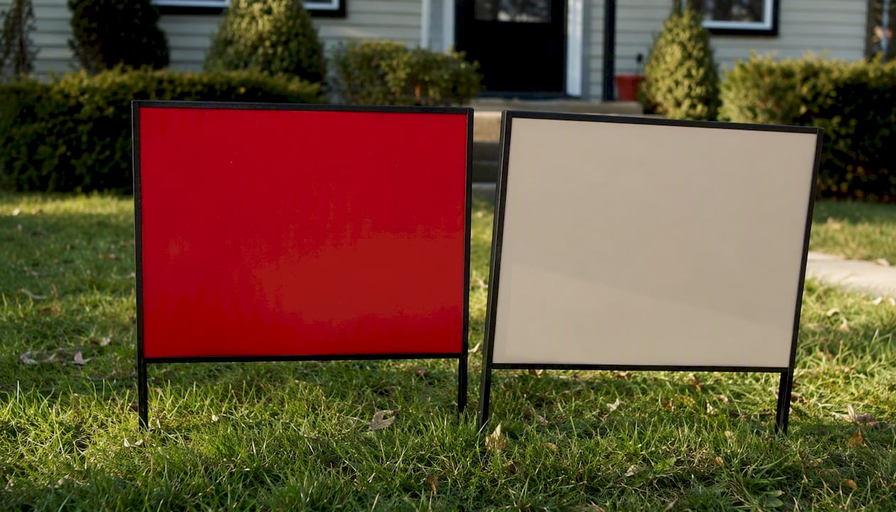 Side-by-side real estate sign color contrast comparison