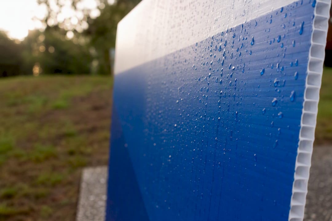 Close-up of weatherproof sponsor sign material outdoors