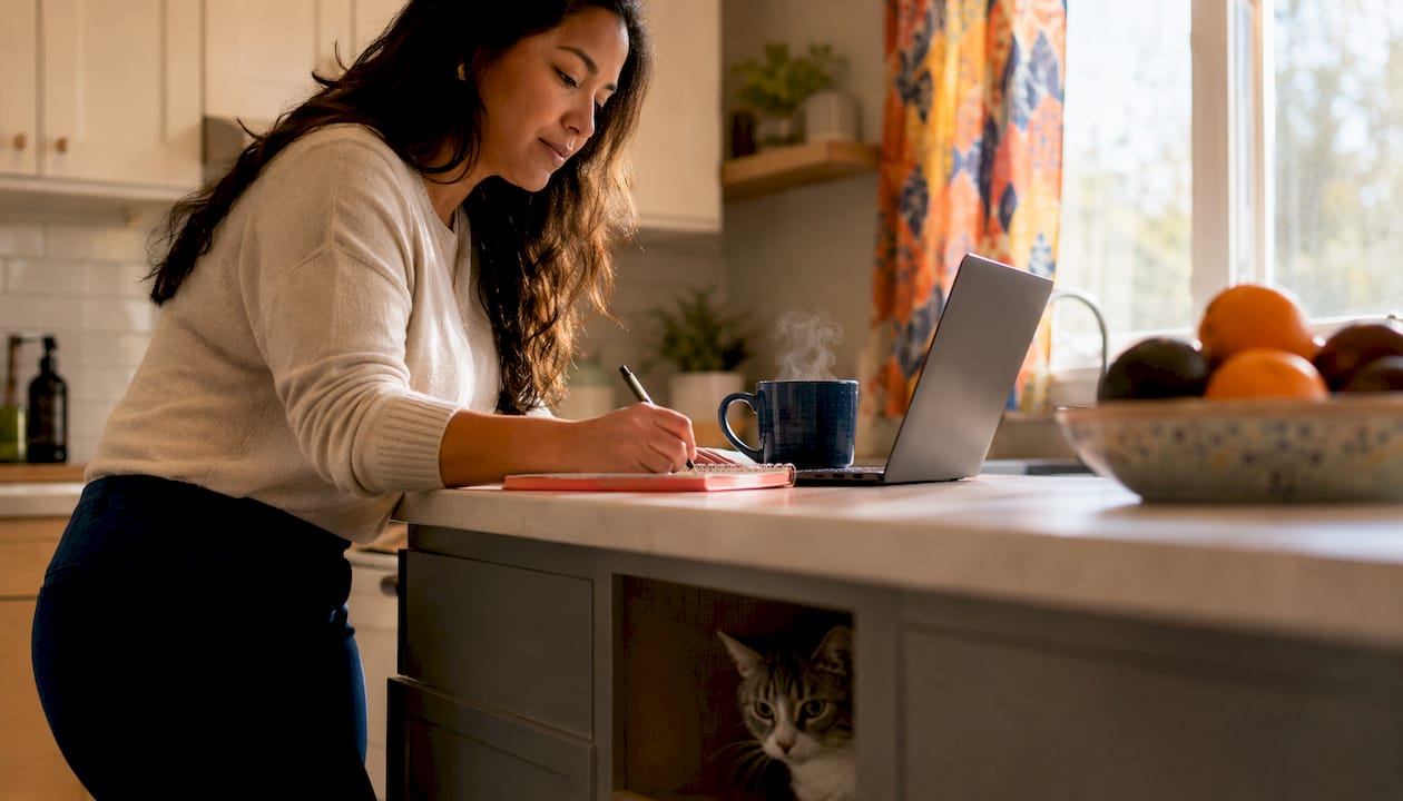 Woman working at standing desk in home office