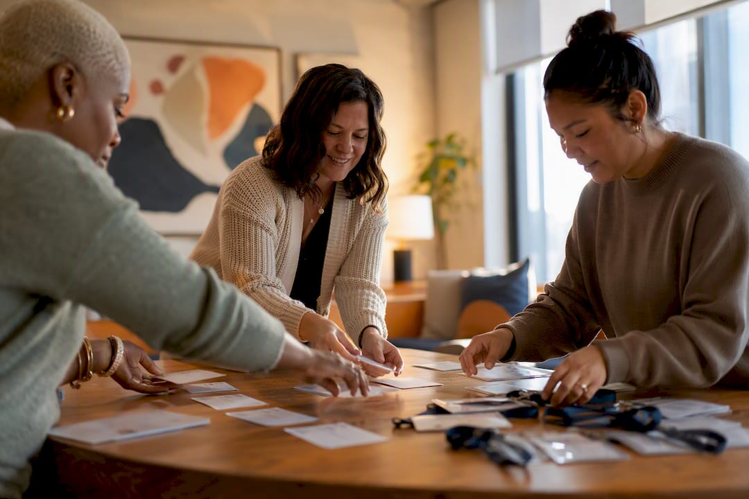 Hands arranging interview training materials