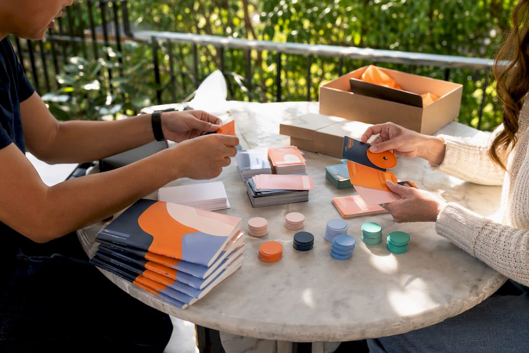 Hands organizing buddy program materials