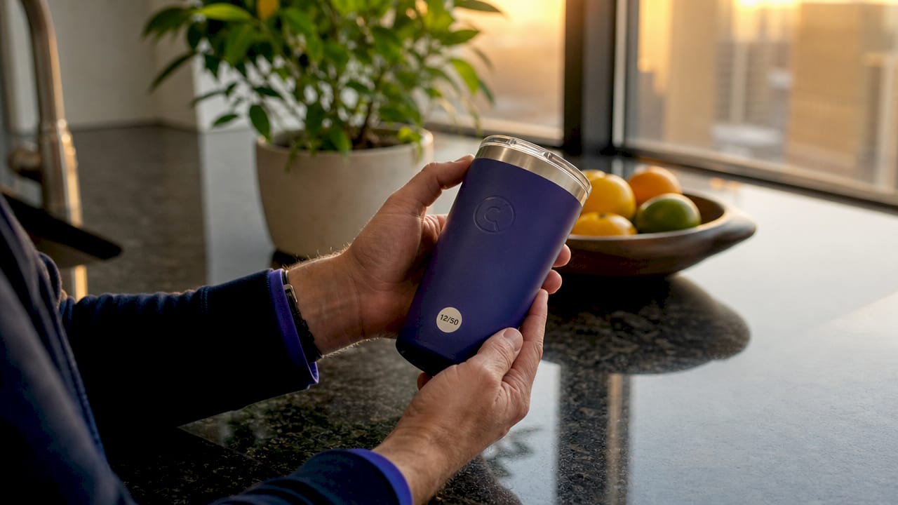 Hands holding serialized promotional tumbler