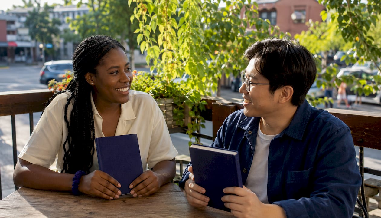 Colleagues discussing personalized company gifts in break room