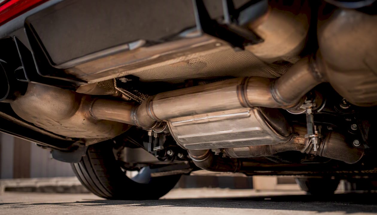Close-up of muffler and resonator pipes