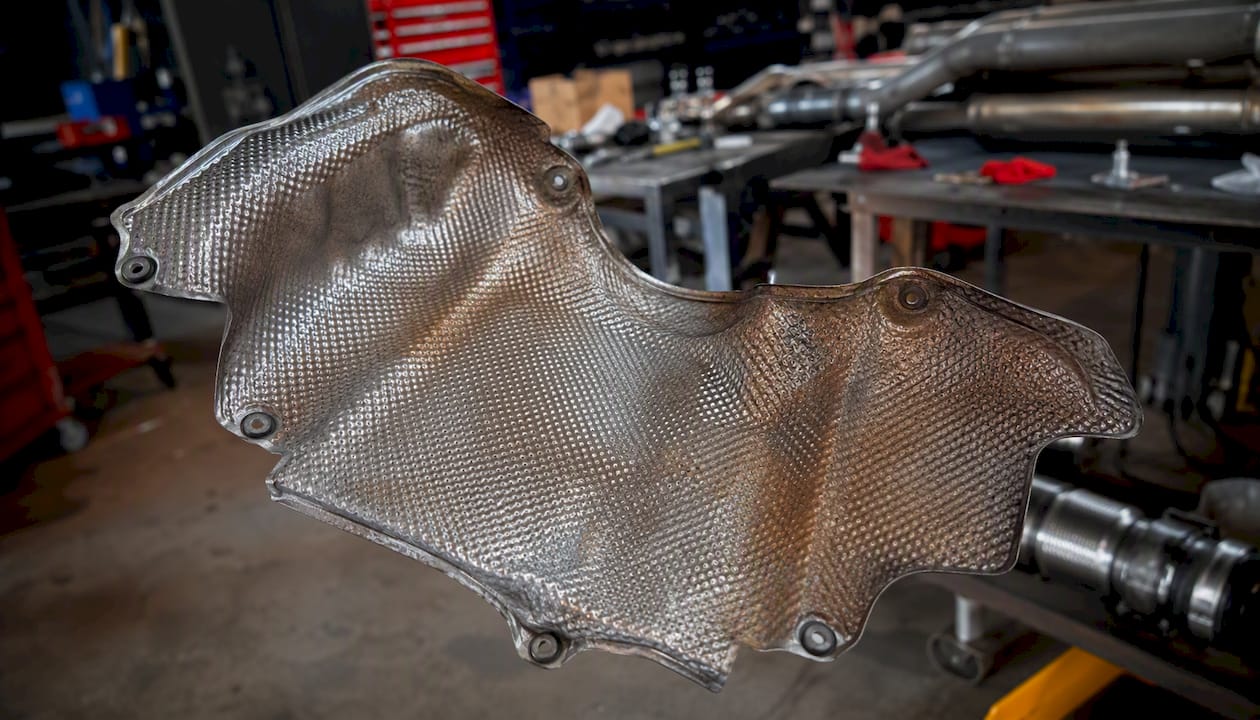 Close-up of exhaust heat shield warming
