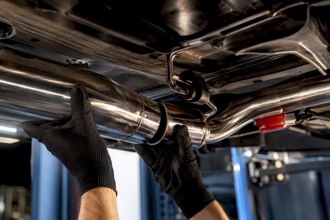 Mechanic aligning valved catback exhaust joints