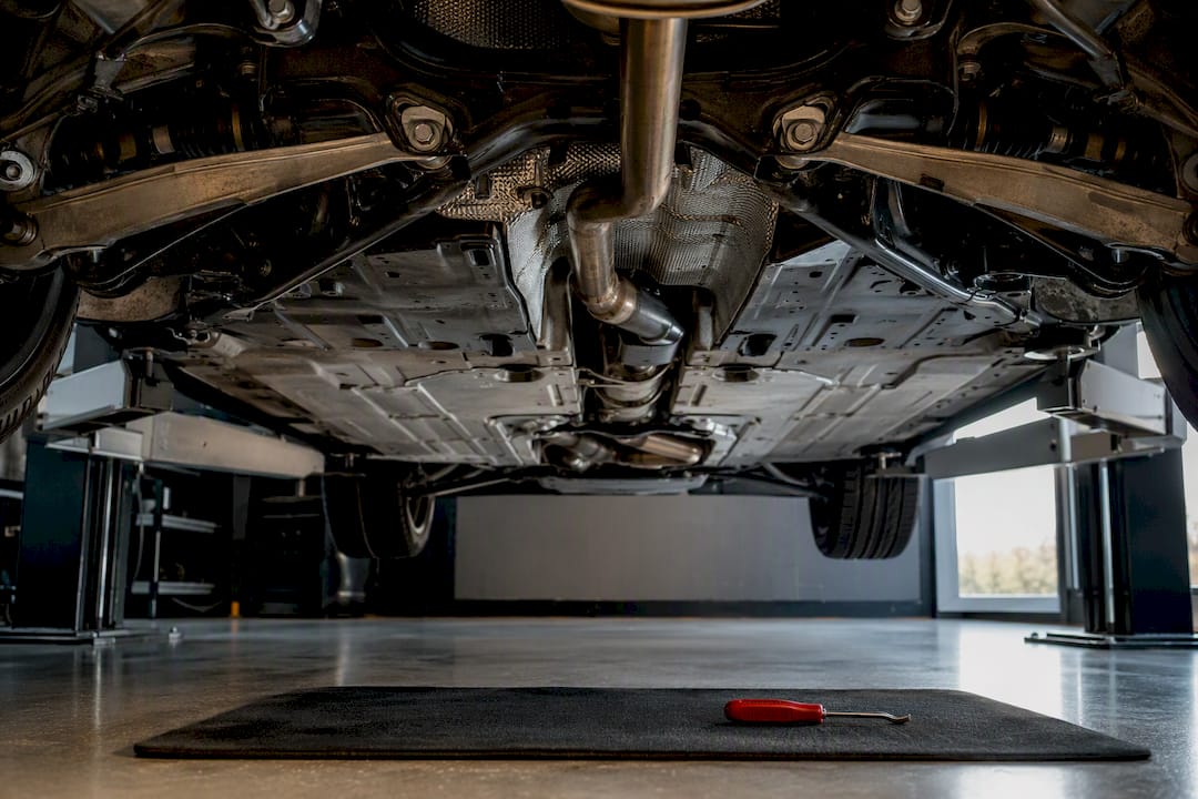 Exhaust and suspension beneath an inspected vehicle