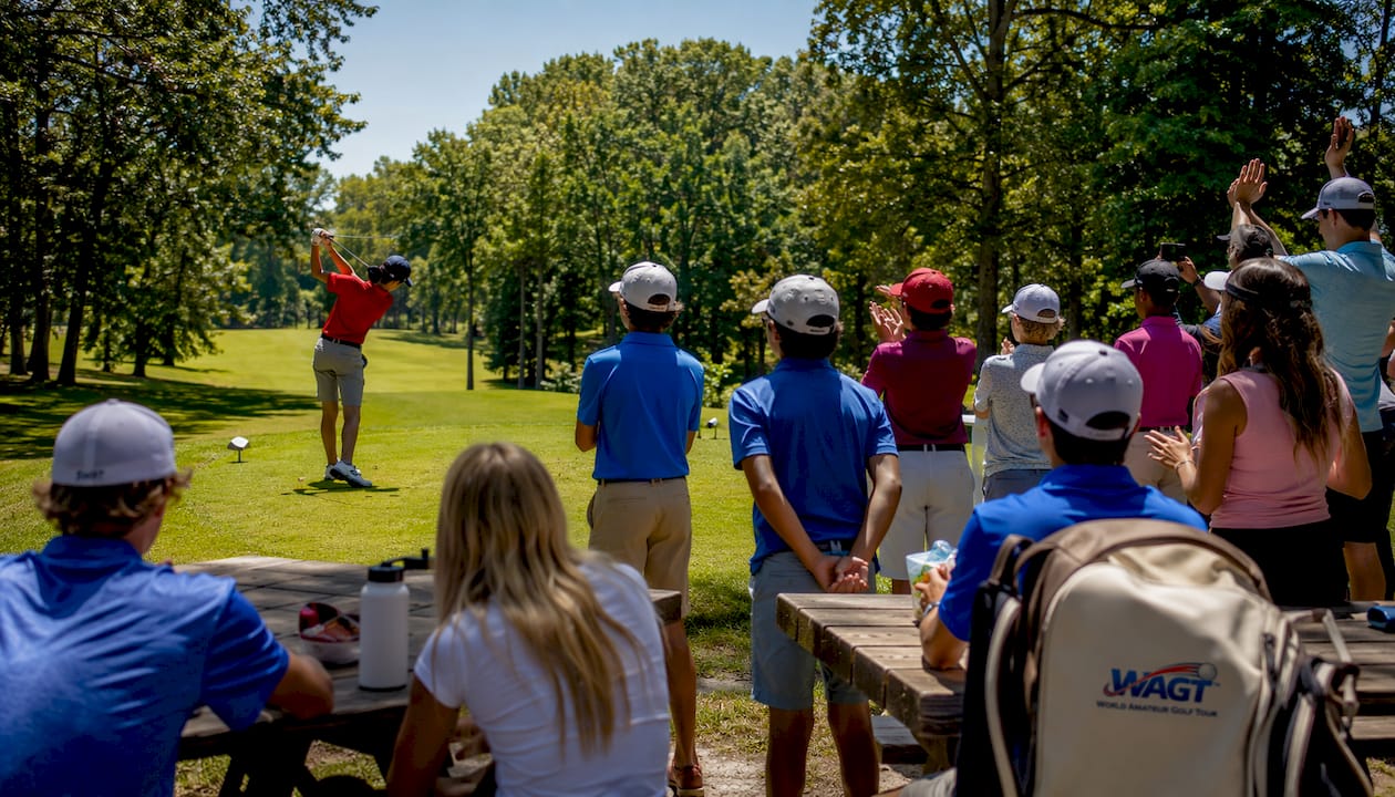 Junior international golf tournament with players and flags