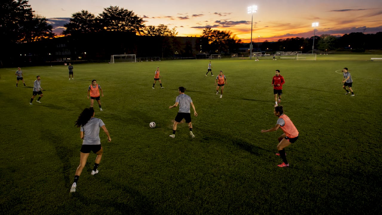 Collegiate soccer team intense training session