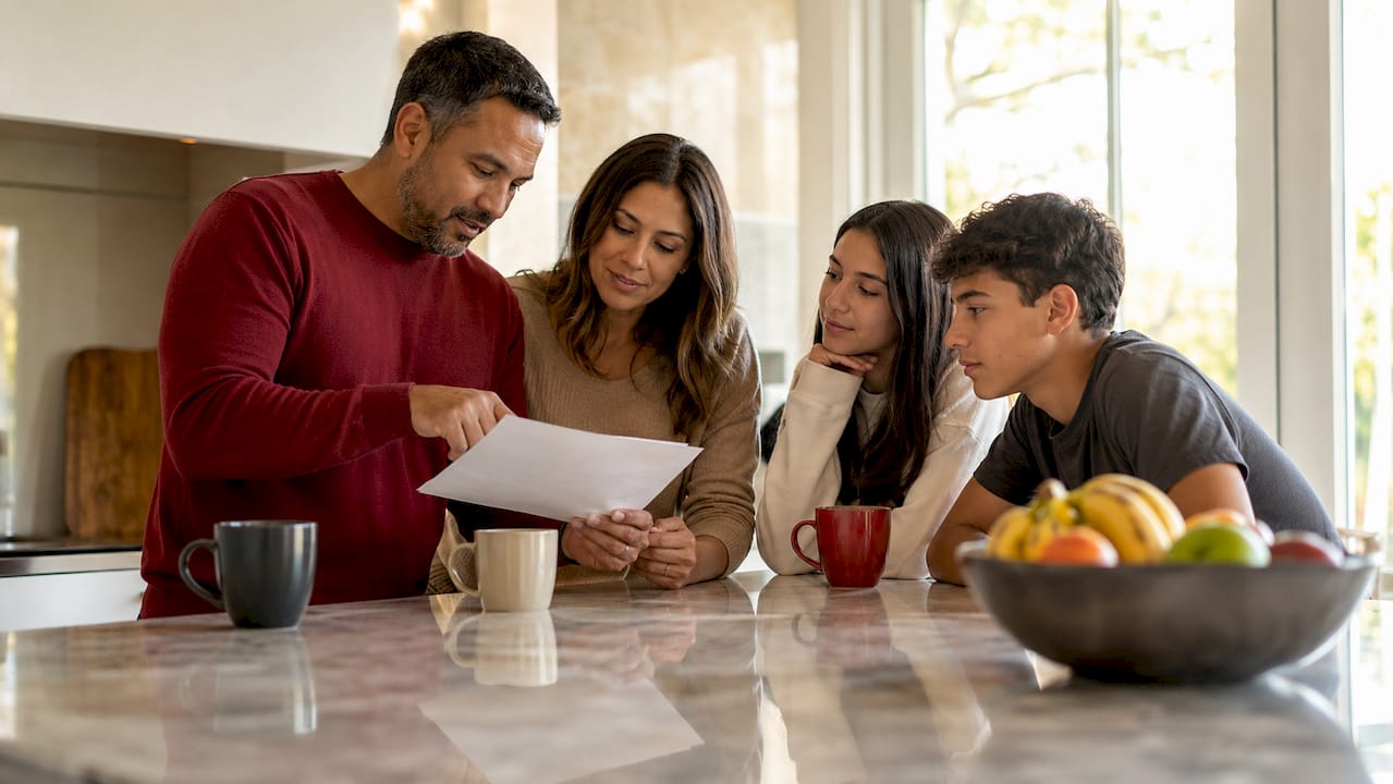 Family discussing soccer scholarship renewal letter