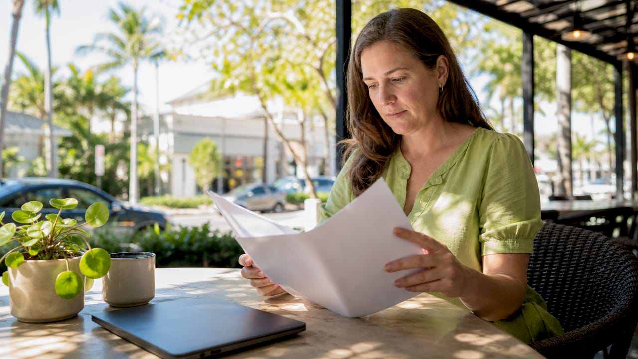 Homeowner reviewing roofing cost estimate