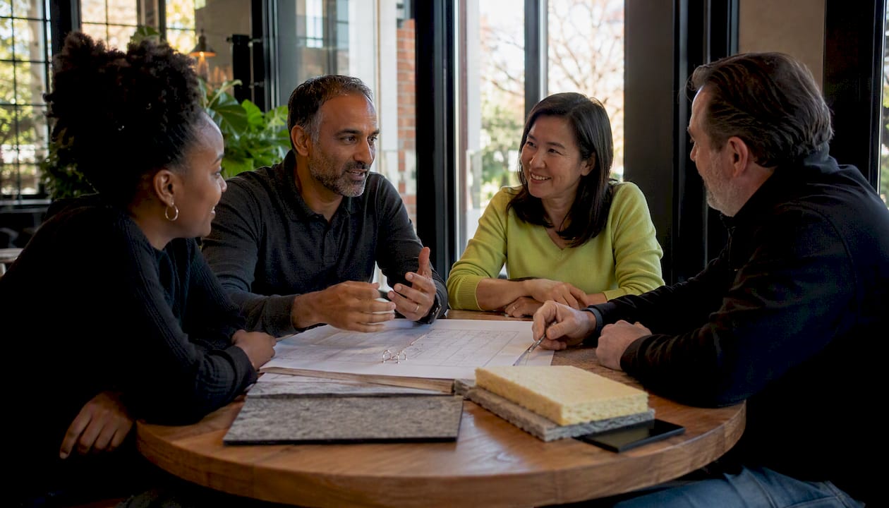 Building owners and consultant discussing insulation choices