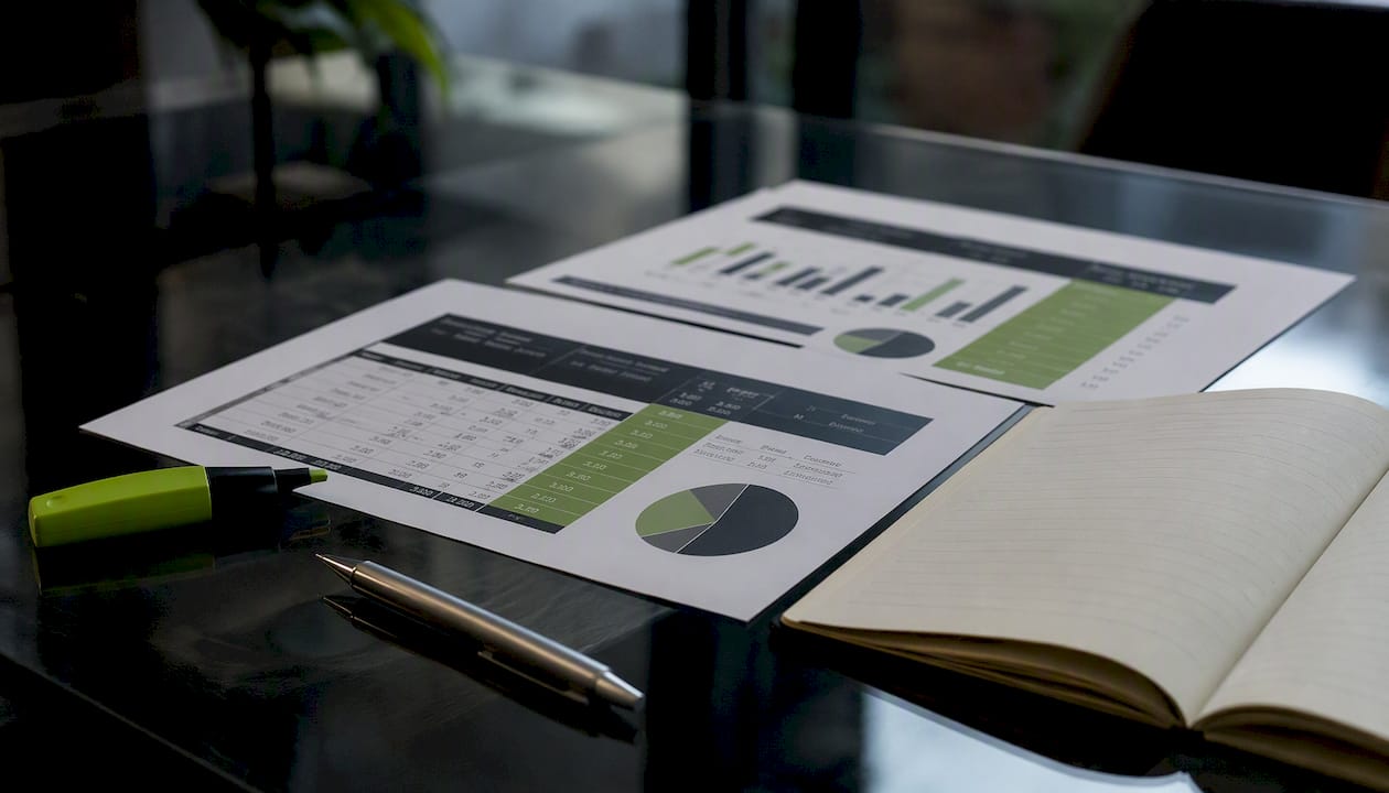Flat lay of roofing financing comparison documents