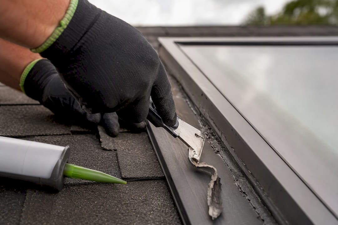 Removing old sealant around skylight frame