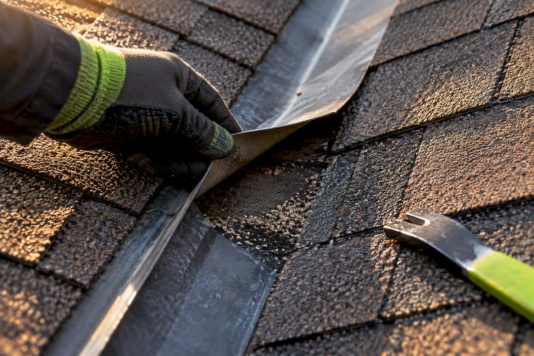 Loose flashing and exposed shingle mat
