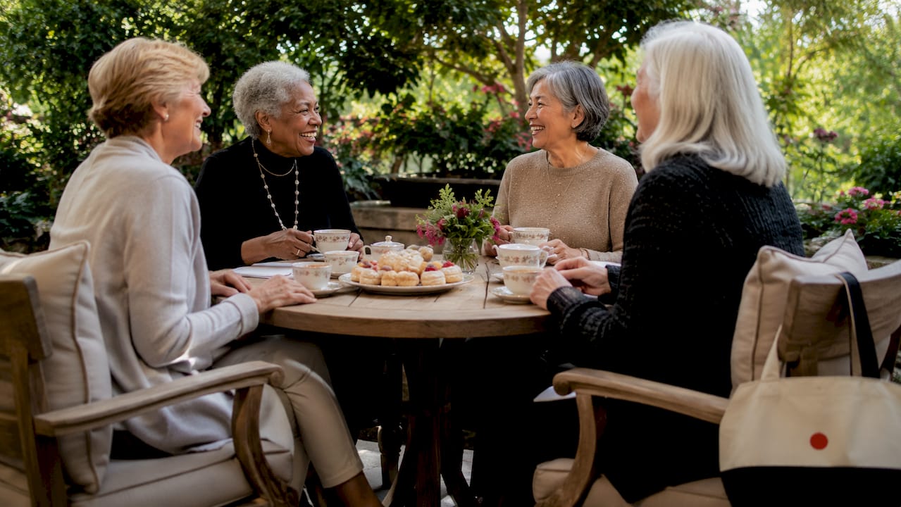 Women socializing in senior living community common room
