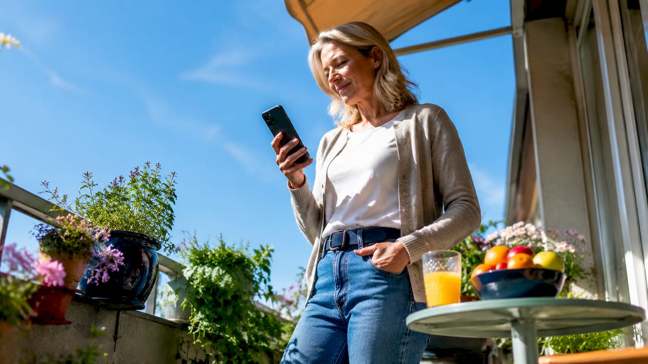 Parent checking UV index on phone at home