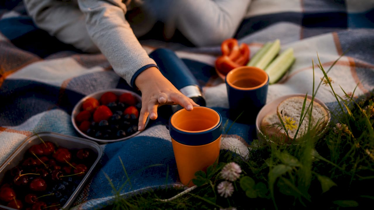 Family picnic table with insulated drinkware