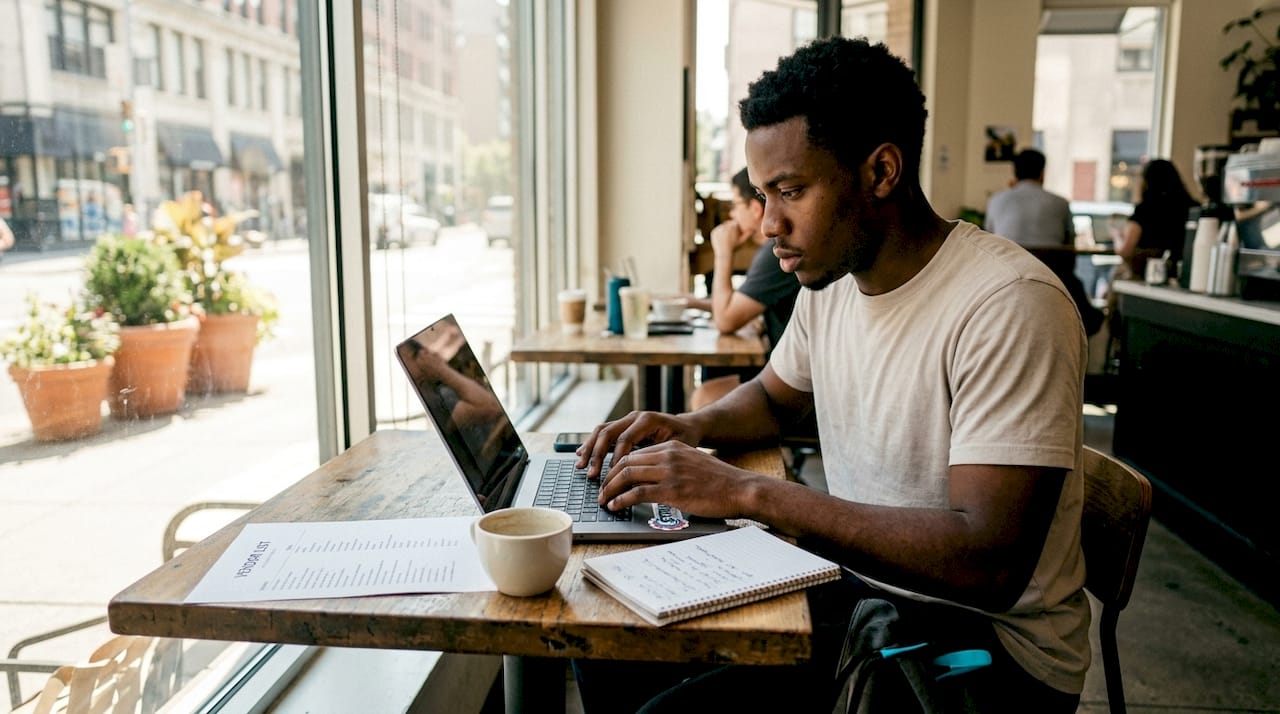Hands typing on laptop to schedule HVAC repair