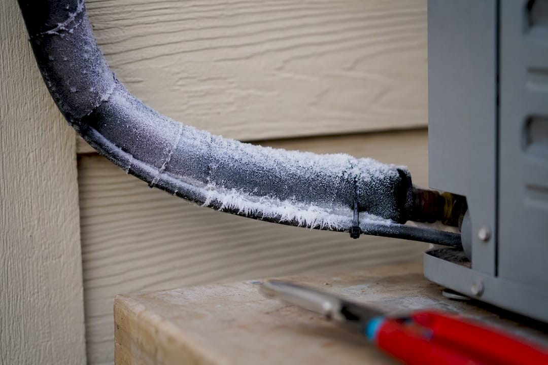Frost forming on an AC refrigerant line