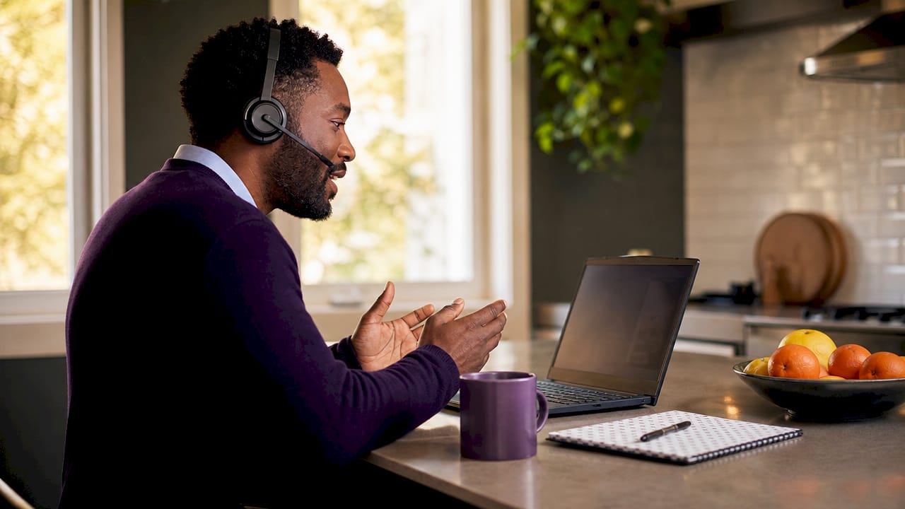 Overhead view of man engaged in telehealth counseling session