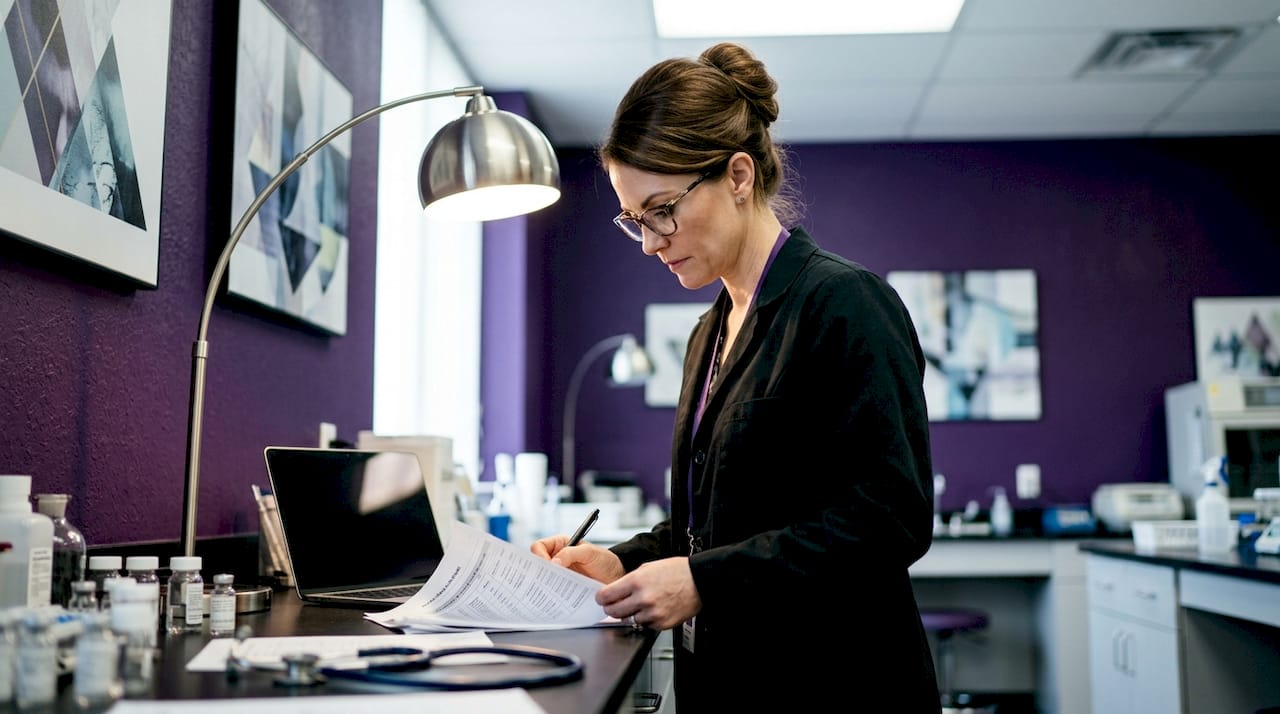Clinical researcher reviewing light therapy trial data