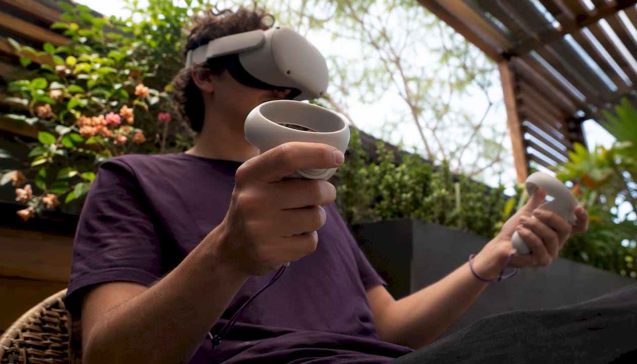 Hands holding VR controllers during anxiety therapy