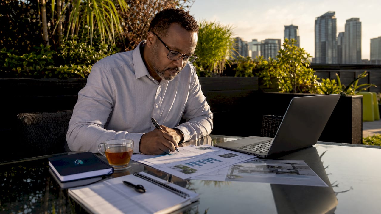 Real estate investor reviewing property documents
