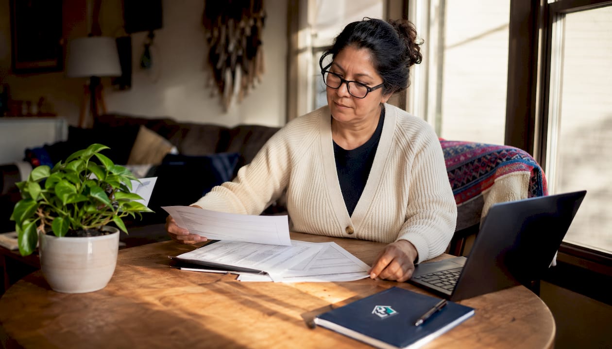 Woman reviewing property management invoices