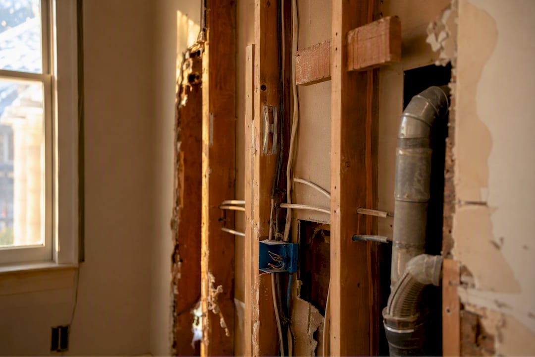 Exposed wall with hidden electrical wiring and gas pipe