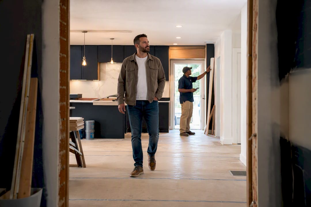 Investor reviewing a partially renovated flip property