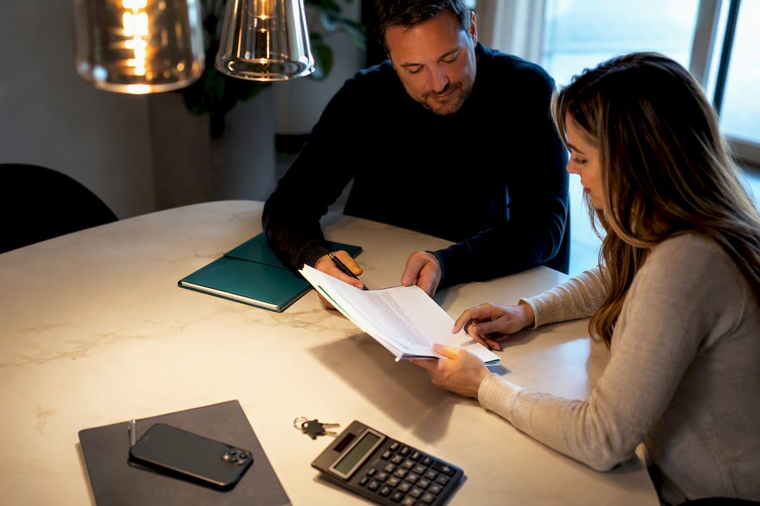 Home closing documents and keys on table