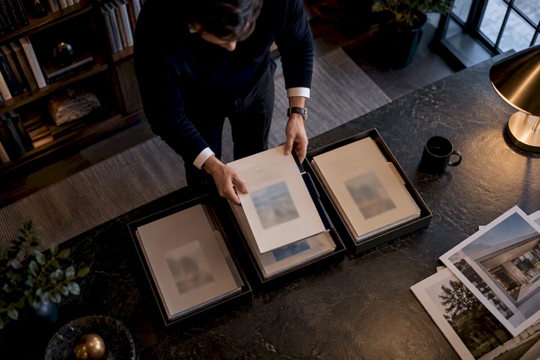 Investor sorting real estate deal folders